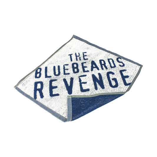 The Bluebeards Revenge Flannel made from 100% cotton, featuring a woven skull and crossbones logo and 'The Bluebeards Revenge' branding in bold lettering.