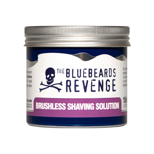 The Bluebeards Revenge Shaving Solution 150ml tin with a purple label, showcasing the product name and signature skull-and-crossbones logo on the container.