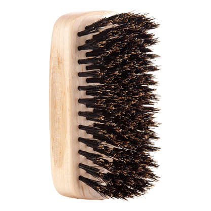 Side view of the Jack Dean Military Brush, showing its handle-less design and densely packed bristles for effective grooming.