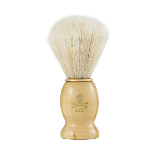 The Bluebeards Revenge Doubloon Synthetic Shaving Brush featuring a natural birch wood handle with a golden logo and soft synthetic bristles for a premium shaving experience.