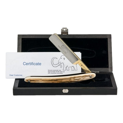 Dovo 5/8" Mammoth Ivory Straight Razor displayed in a wooden storage box with certificate of authenticity.