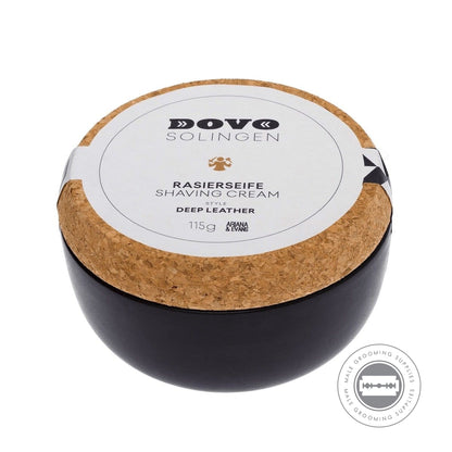 Angled view of the Dovo Shaving Soap in Ceramic Bowl - Deep Leather 115g, showcasing the premium stoneware jar and cork lid.