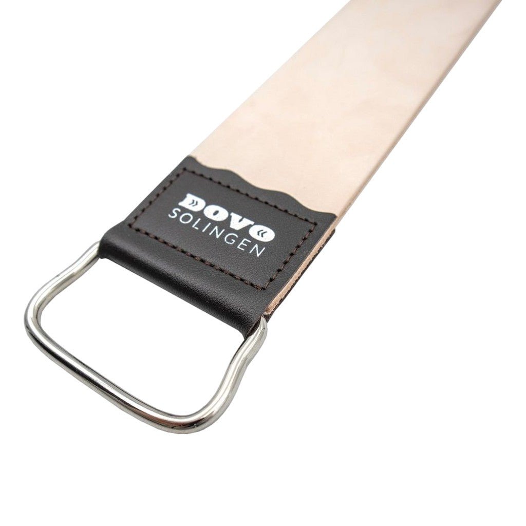 Close-up of the Dovo Straight Razor Strop showing the Dovo Solingen logo on black leather and the nickel-plated metal D-ring handle.