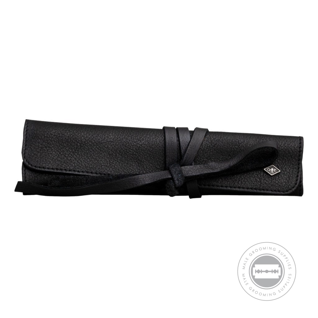 G&F Timor® Black Leather Roll-Up Razor Case fully rolled and secured with a leather strap.