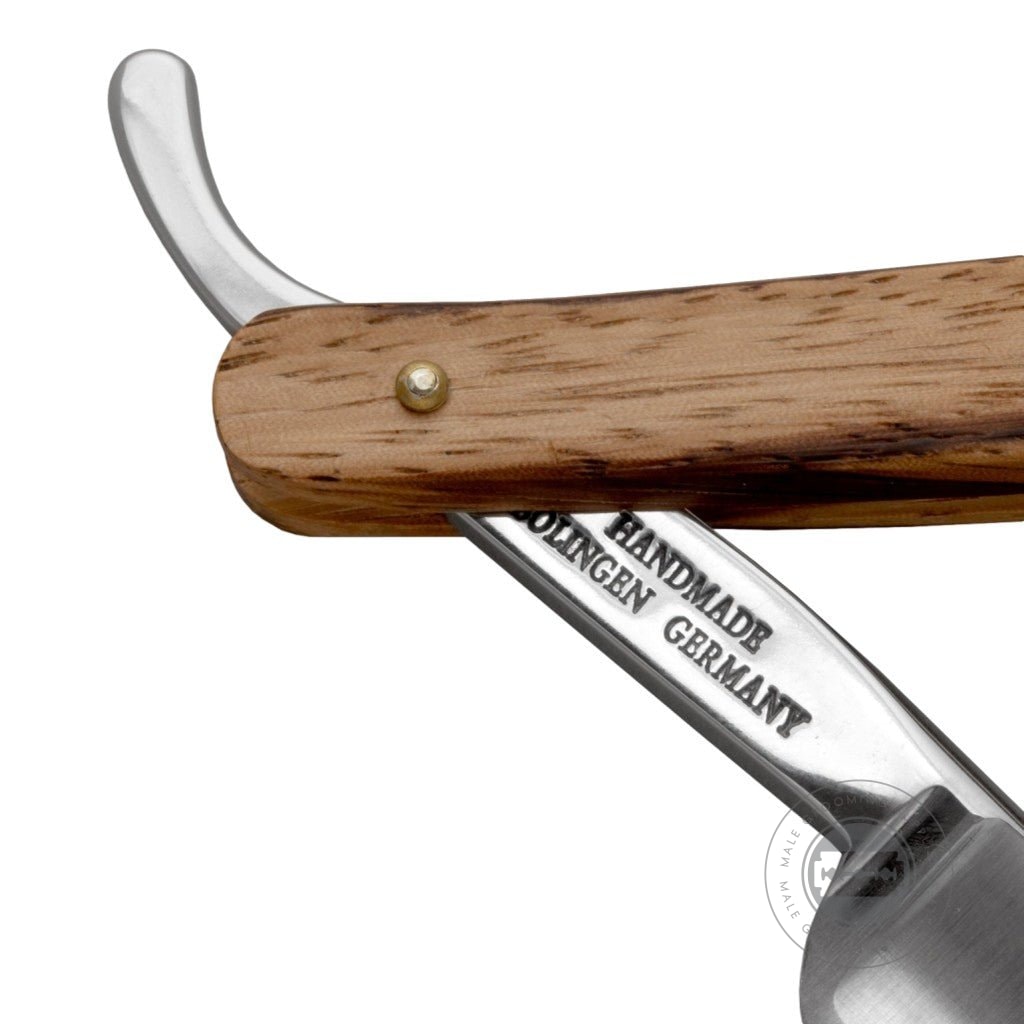 Close-up of the Zebrano wood handle on the G&F Timor® Deluxe Razor 5/8, highlighting its natural grain.