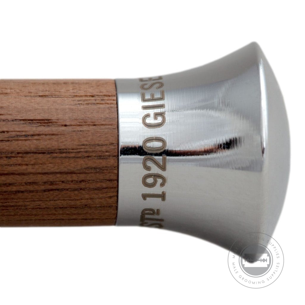 Detailed view of the walnut handle with engraved Giesen & Forsthoff branding.