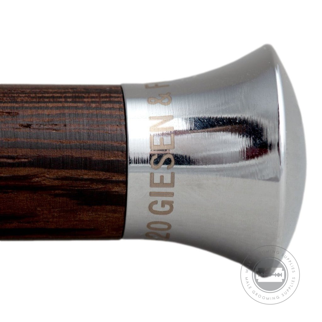 Highlight of the engraved base of the wenge wood handle with chrome-plated brass accents.