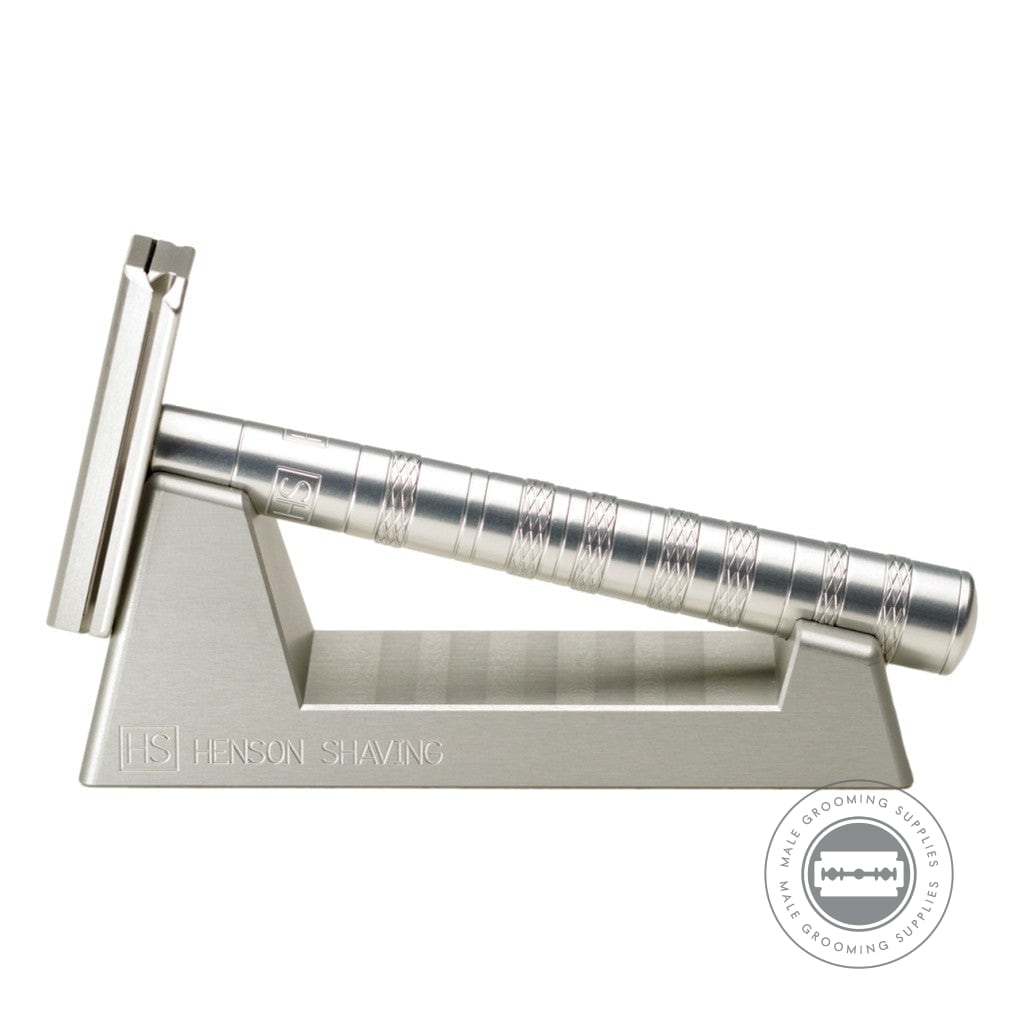 Henson AL13 Safety Razor V2.0 in Aircraft Aluminium displayed on its stand, showcasing the precision-engineered handle and head design.