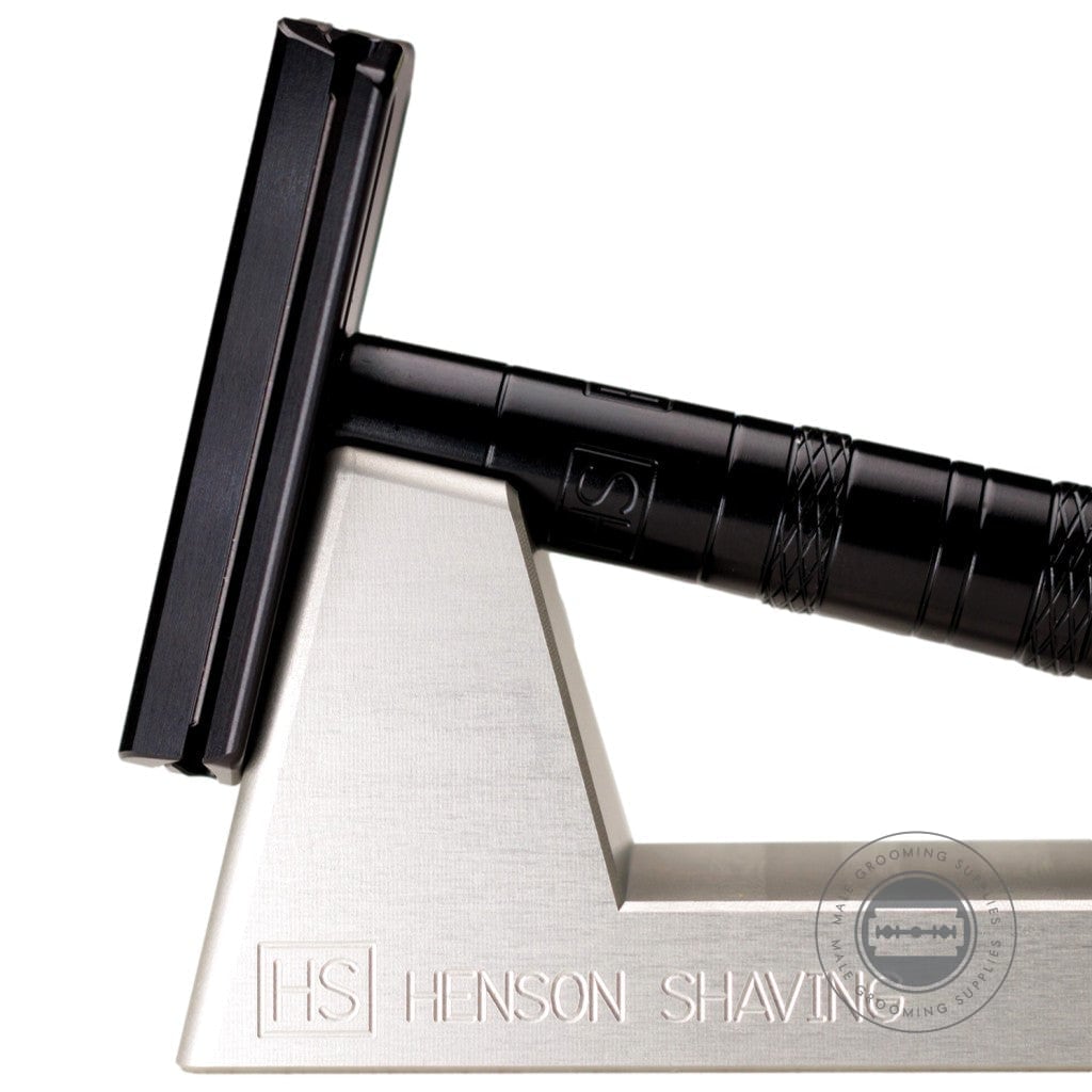 Close-up of the Henson AL13 Safety Razor V2.0 Jet Black Edition on stand, showcasing the matte black finish and design.