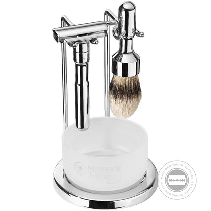 Merkur FUTUR 4-Piece Polished Chrome Shaving Set 751 001 featuring adjustable razor, silvertip badger brush, satin glass soap dish, and chrome stand for modern grooming.