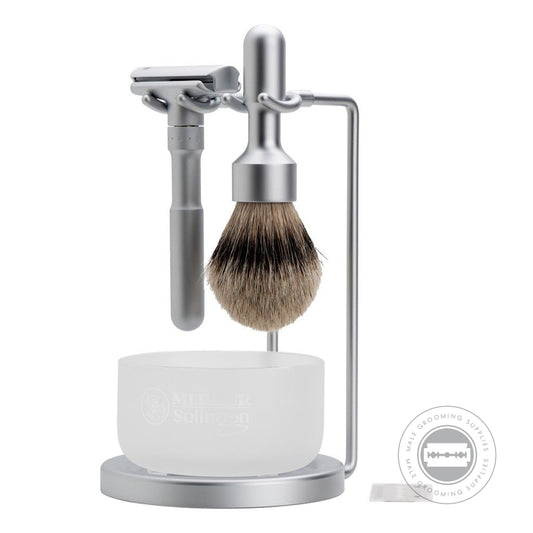 Merkur FUTUR Satin/Matt 4-Piece Shaving Set 750002 featuring adjustable razor, silvertip badger brush, satin glass soap dish, and matt chrome stand for modern grooming - front view.