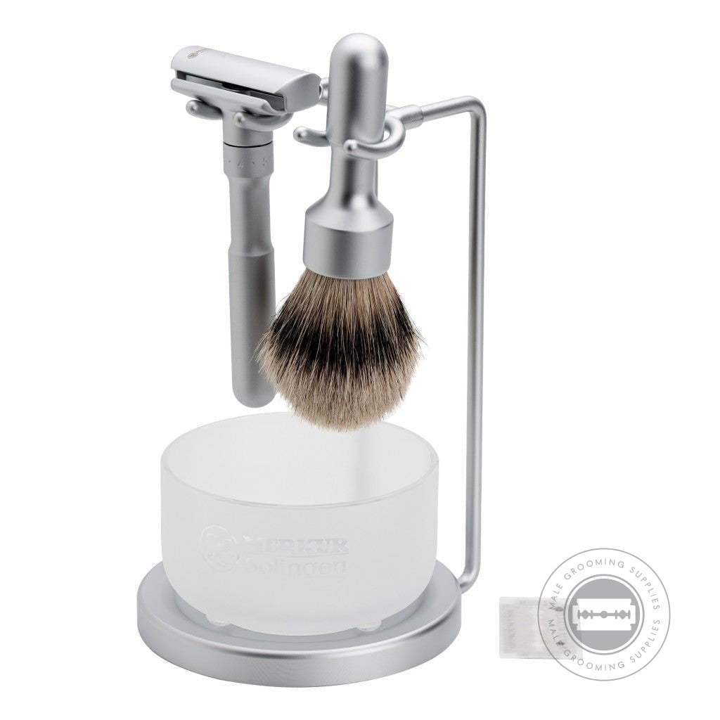 Merkur FUTUR Satin/Matt 4-Piece Shaving Set 750002 featuring adjustable razor, silvertip badger brush, satin glass soap dish, and matt chrome stand for modern grooming - side view.