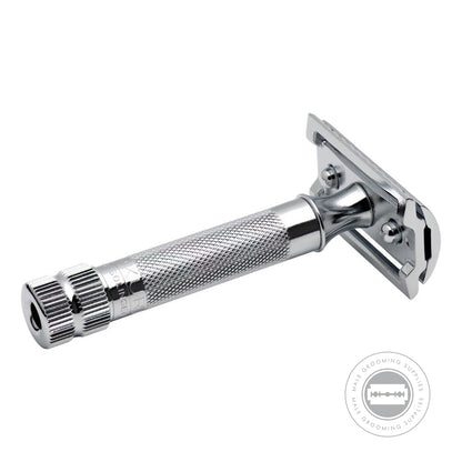 Side view of the Merkur 34001 Heavy Duty Safety Razor, displaying the handle positioned in front and the underside of the razor head.