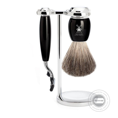 Muhle 3-Piece M3 Shaving Set from the VIVO series, including a Pure Badger shaving brush, Gillette® Mach3® compatible razor, and a chrome-plated stand with black resin handles.