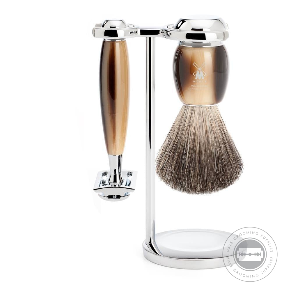 Muhle 3-Piece Safety Razor Shaving Set from the VIVO series, featuring horn brown resin handles, a Pure Badger brush, closed-comb razor, and chrome-plated stand.