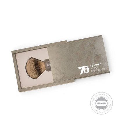 Muhle 70th Anniversary Silvertip Badger Shaving Brush in a wooden presentation box, featuring the special edition 70 years Muhle logo.