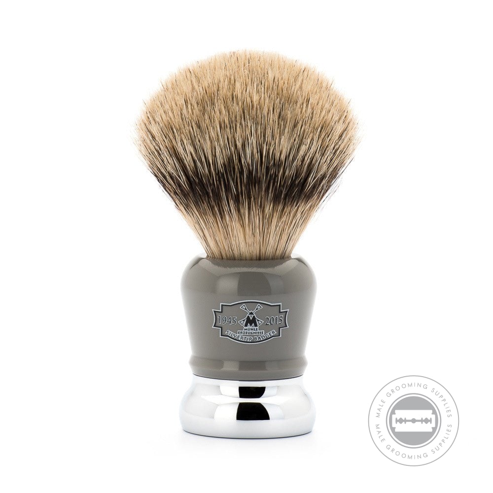 Close-up view of the Muhle 70th Anniversary Silvertip Badger Shaving Brush with a high-grade grey resin handle, chrome-plated accents, and laser-etched 70th Anniversary logo.