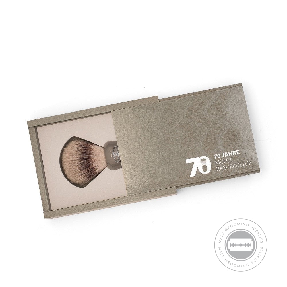 Muhle 70th Anniversary Silvertip Fibre® Shaving Brush in grey high-grade resin, presented in a sleek wooden box, celebrating 70 years of shaving culture.