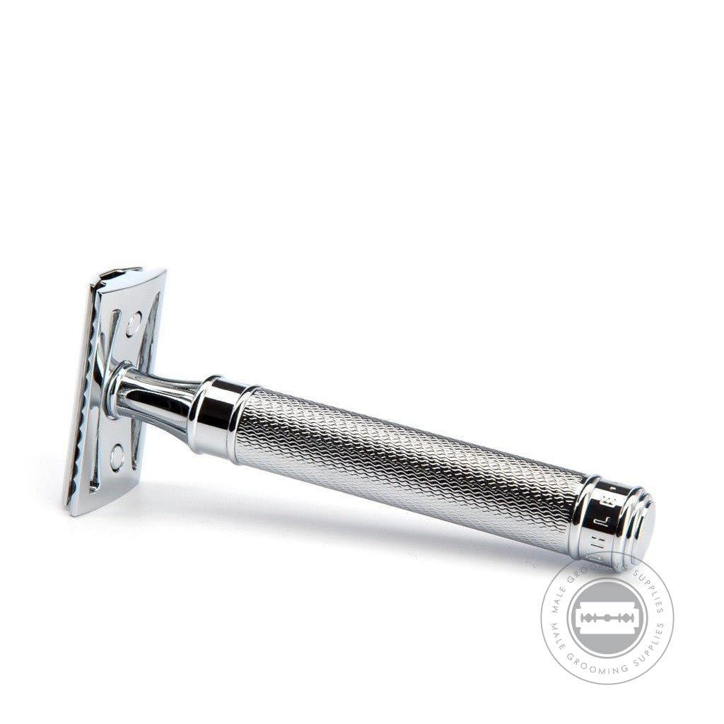 Single Muhle R89 Grande Safety Razor laid flat, showing the handle's knurled texture and chrome finish for a secure grip.