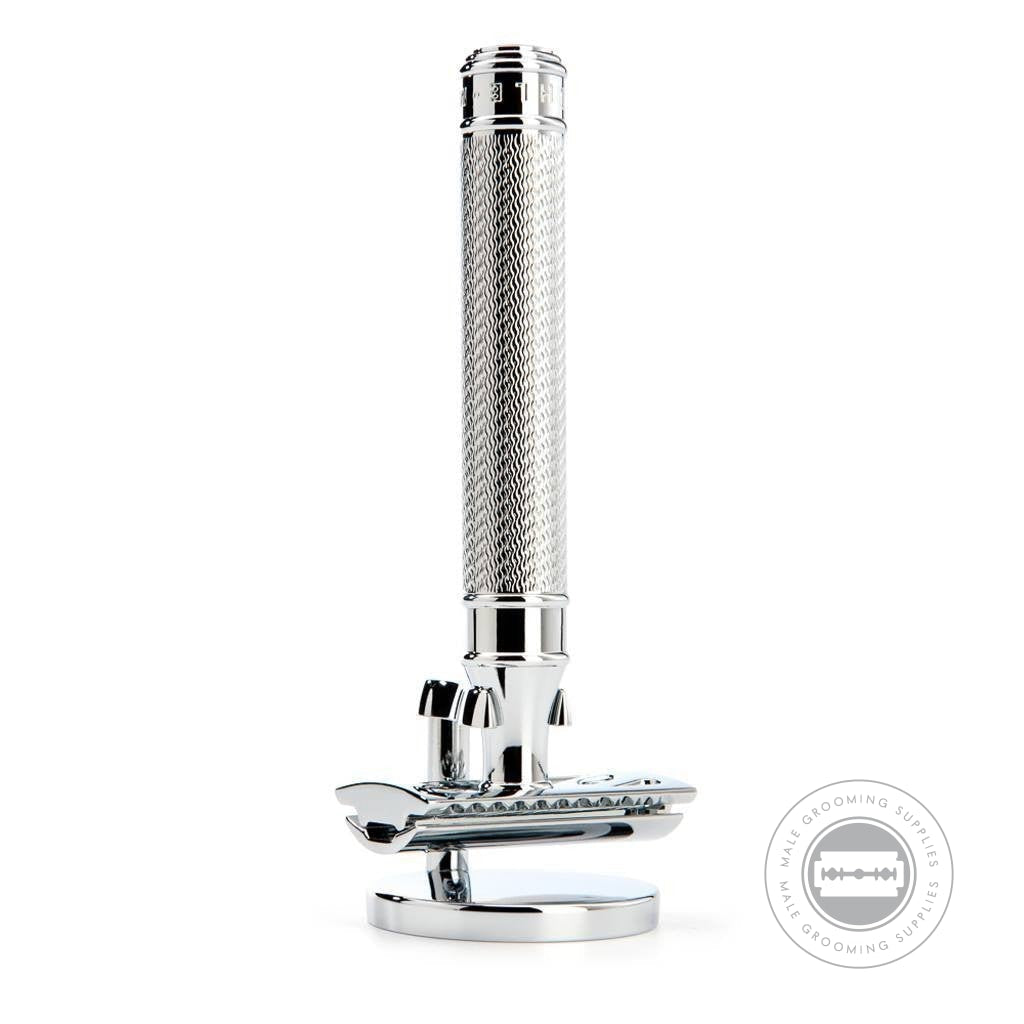 Close-up of Muhle R89 Grande Safety Razor with chrome-plated handle on a matching stand, showcasing the intricate handle texture and sleek design.