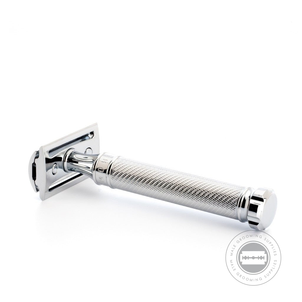 Muhle R89 Twist Safety Razor lying flat with the razor head detached, highlighting its build quality and twist mechanism.