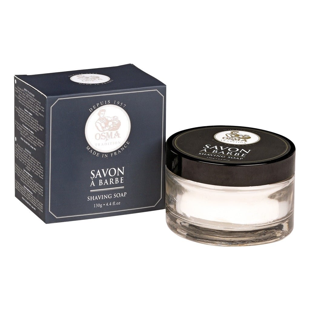 Osma Tradition Shaving Soap 130g in an elegant glass jar with a black lid, featuring natural ingredients like coconut oil and shea butter for a smooth shave.