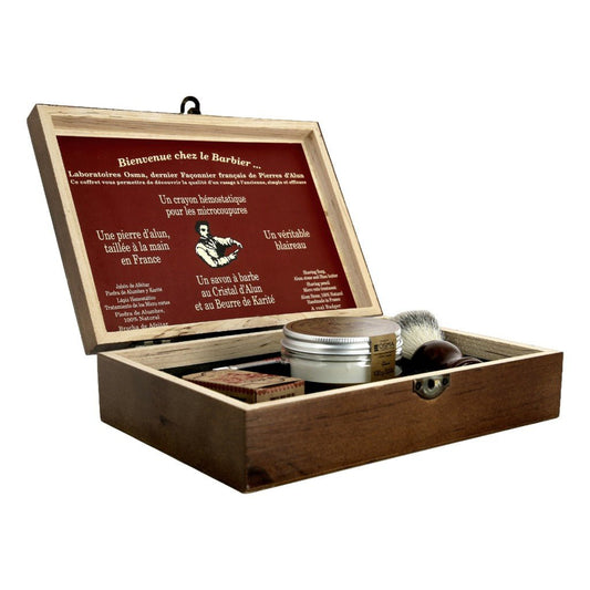 Osma Shaving Box featuring a rustic, handcrafted pinewood box with a vintage finish, containing a badger hair brush, alum shaving soap, alum stone, and shaving pencil for a complete traditional shaving experience.