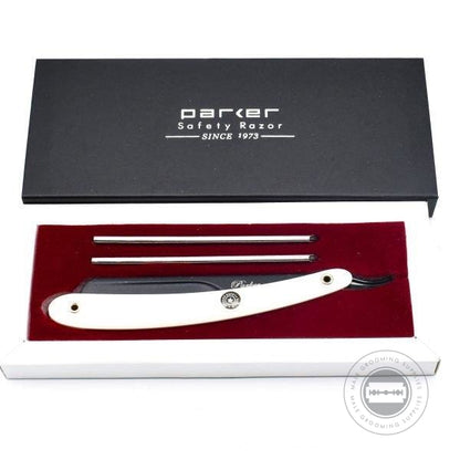 Parker PTAWH Adjustable Barber Razor in a black gift box with a white handle, red interior, and three blade inserts.